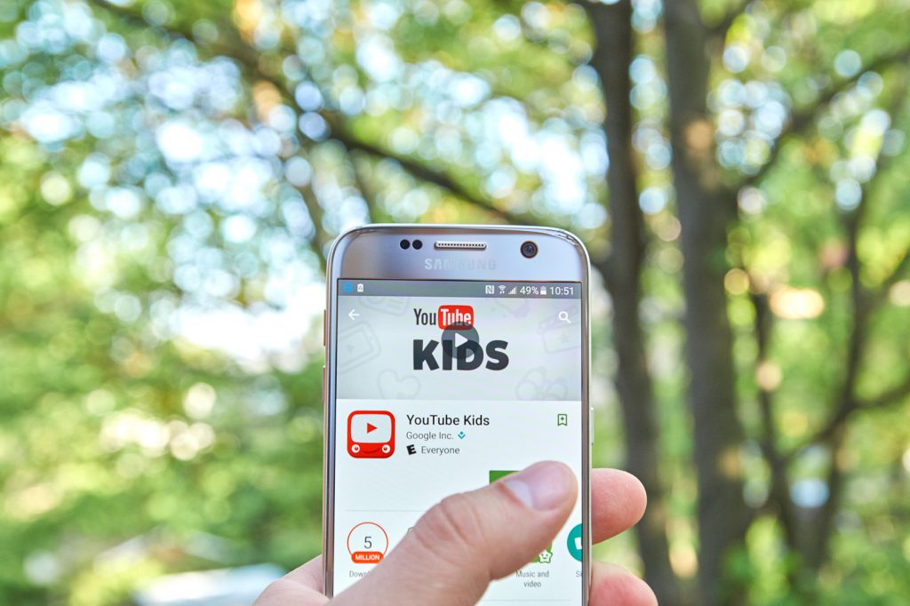 Close up of a phone screen with the Youtube Kids app displayed