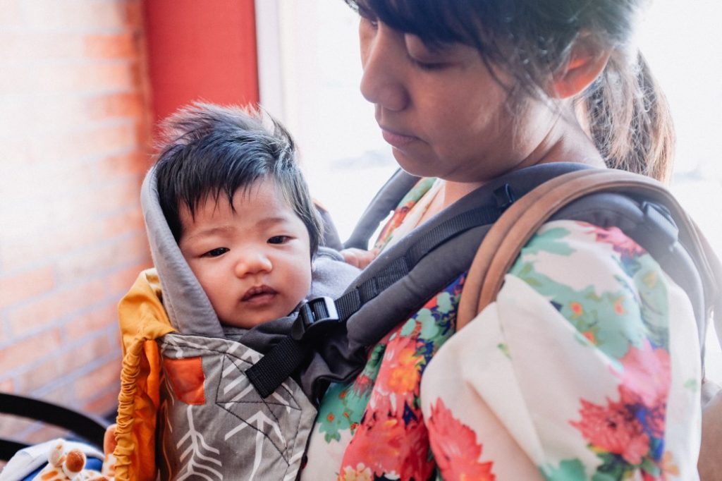 Babywear when you travel to keep your hands free to wrangle the bigger ones.