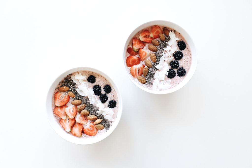 Picture of two smoothie bowls on white background
