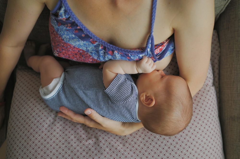 Mom holding her baby breastfeeding