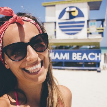 Women smiling on the beach