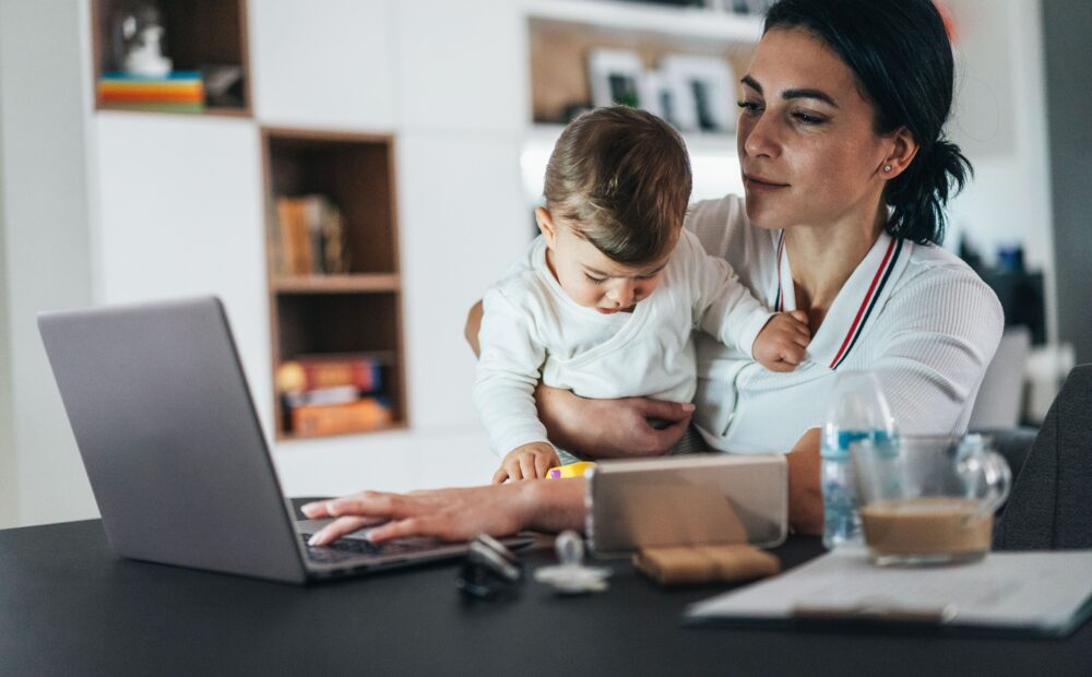 covid's impact on working moms on computer