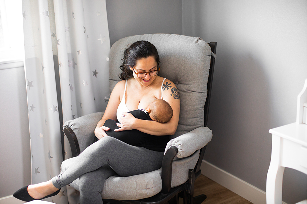 Breastfeeding Mother with baby on couch