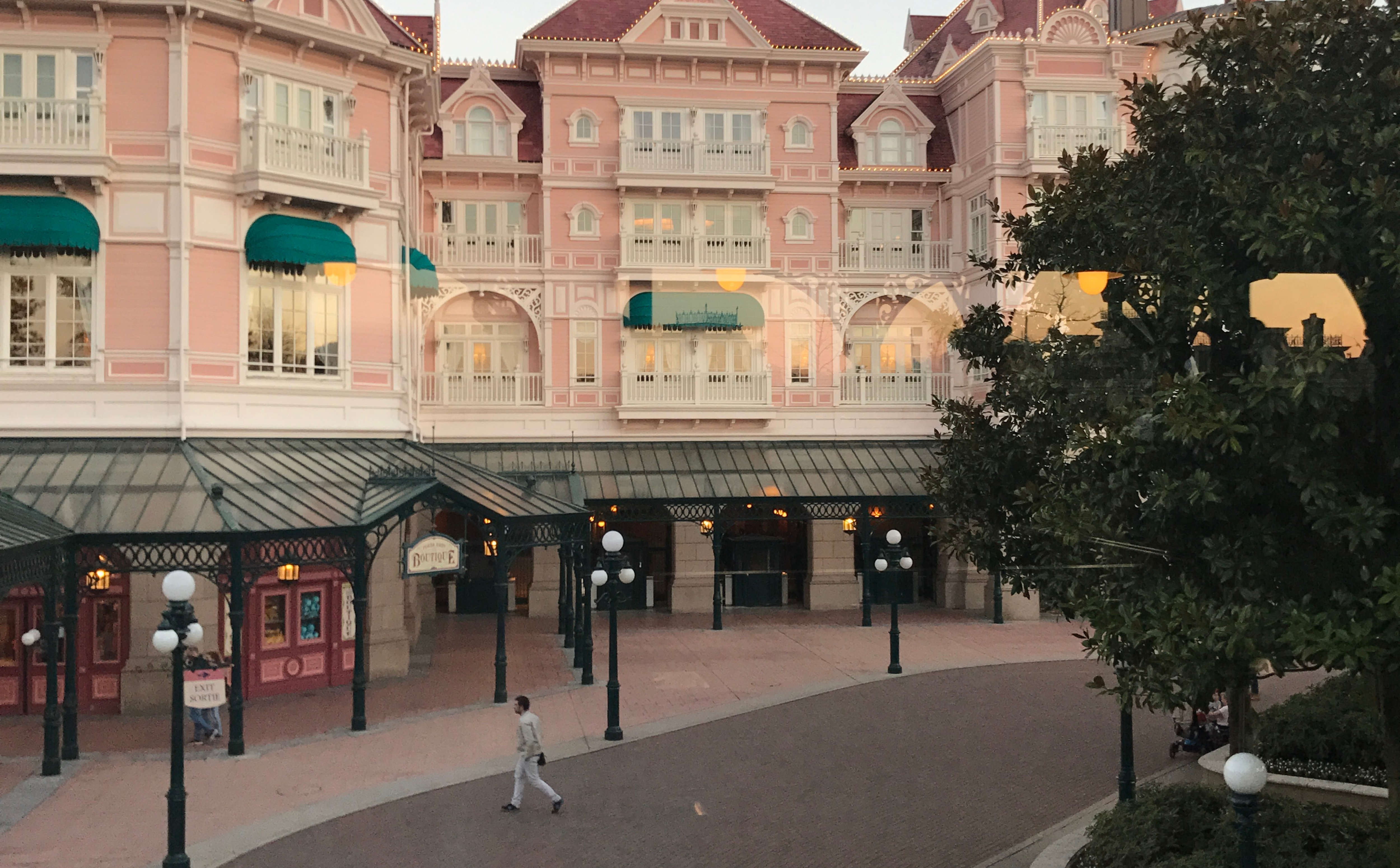 Man walking on Disney Main Ave.