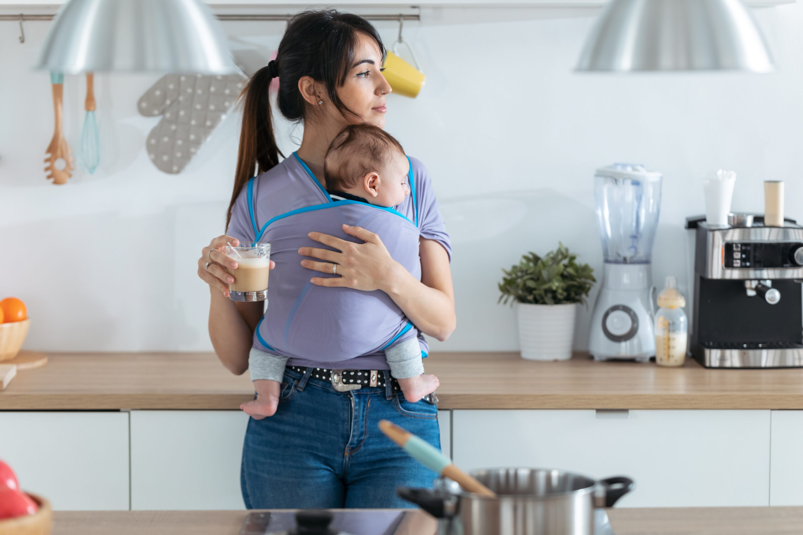 Shot,Of,Pretty,Young,Mother,With,Little,Baby,In,Sling