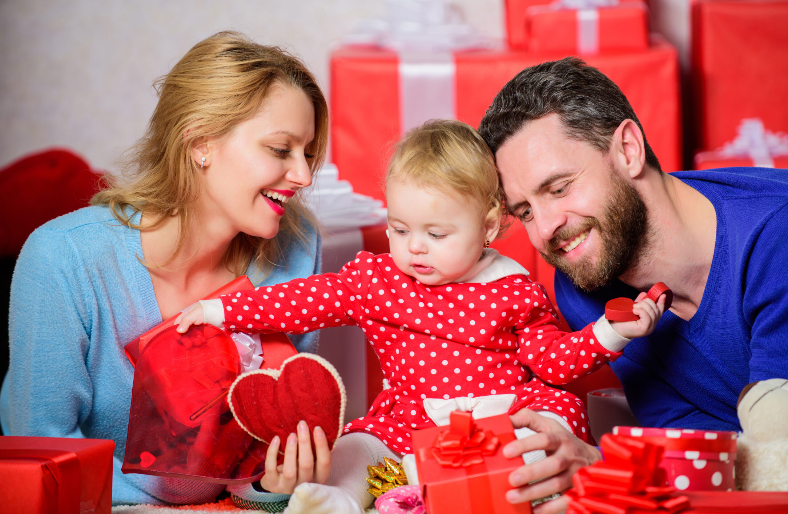 couple in love and baby girl. valentines day concept. together on valentines day. lovely family celebrating valentines day. happy parents. family celebrate anniversary. day to celebrate their love