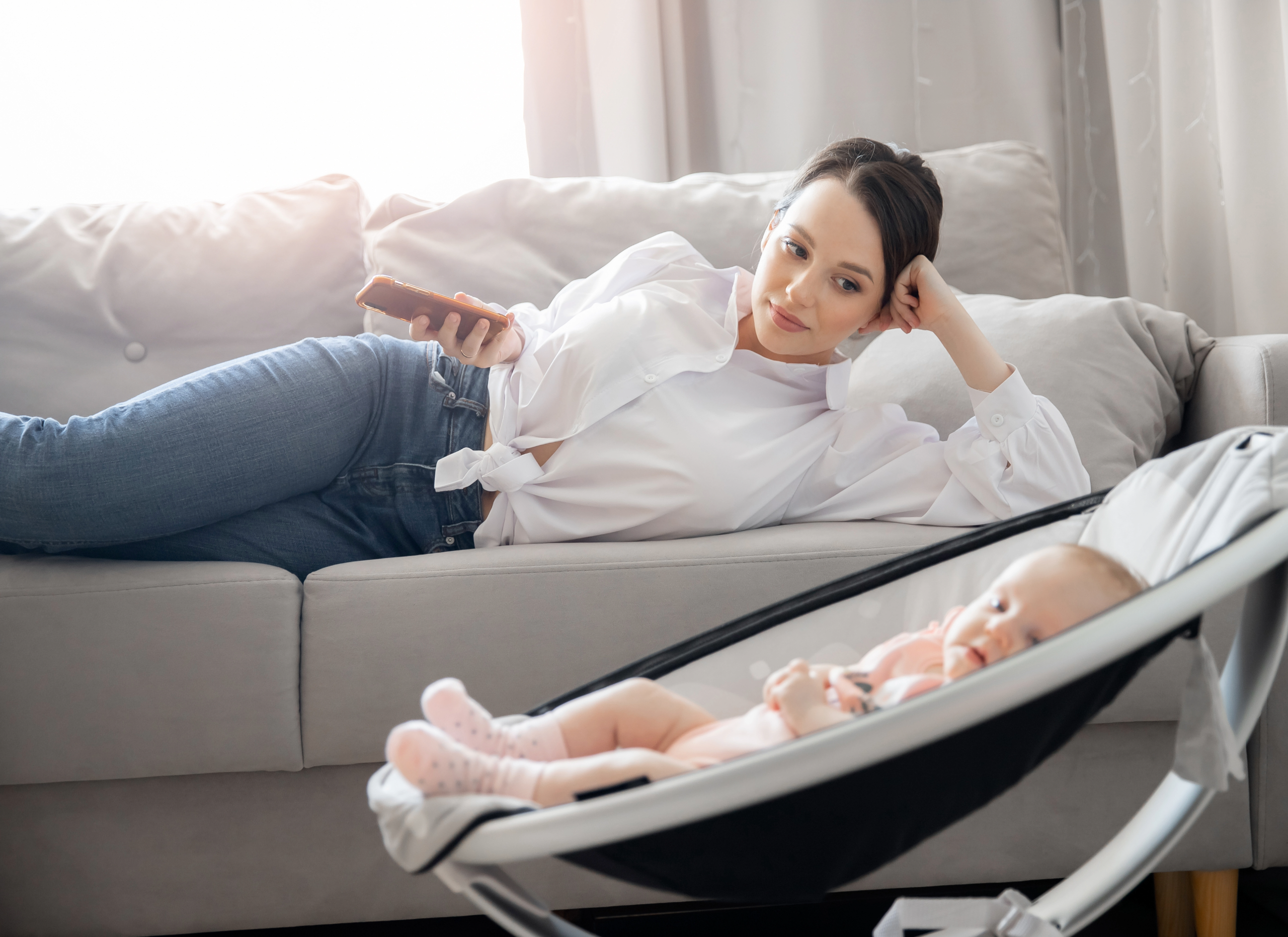 Mother taking a break from work to spend time with baby