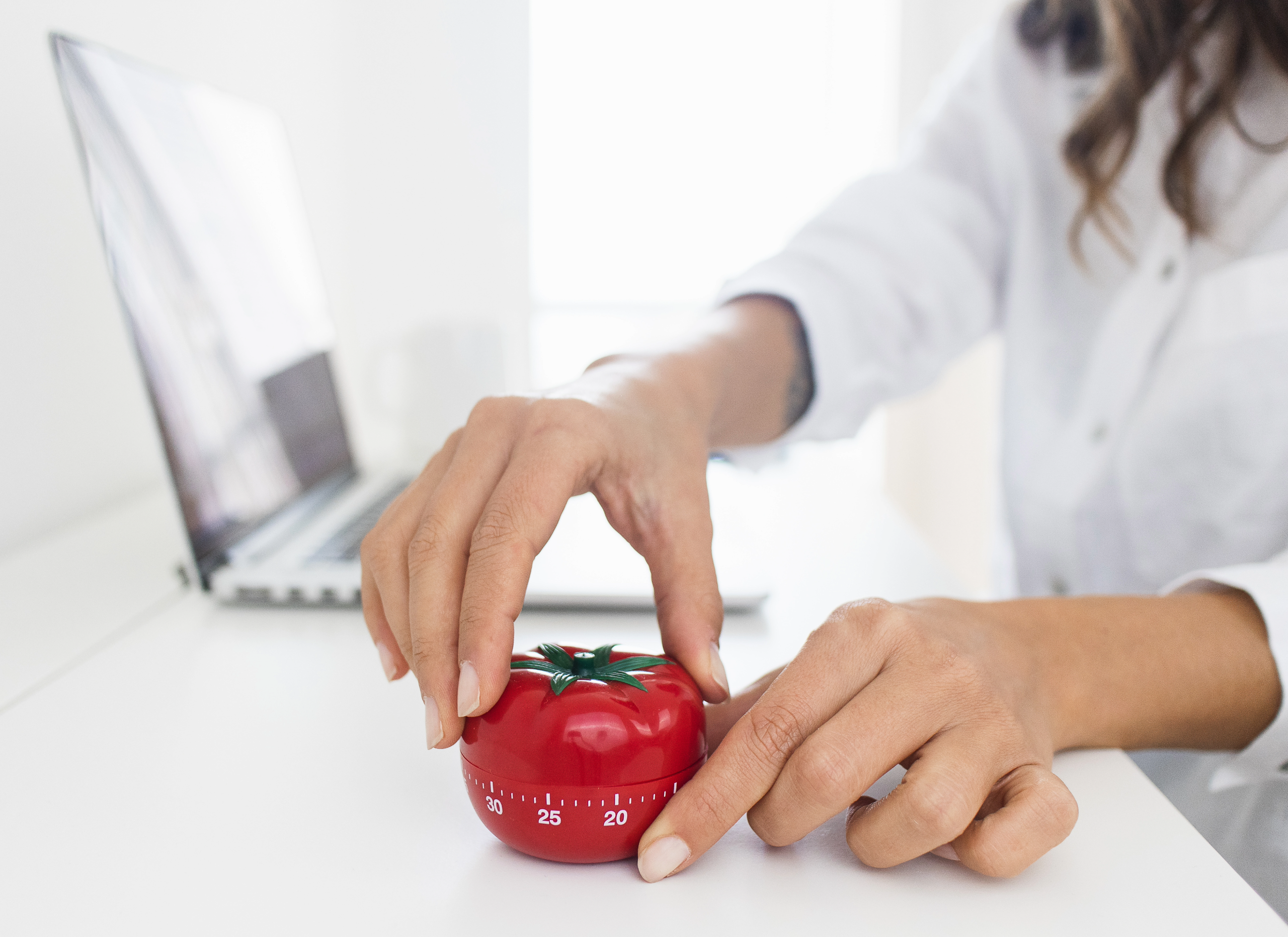 Women in home office setting a timer