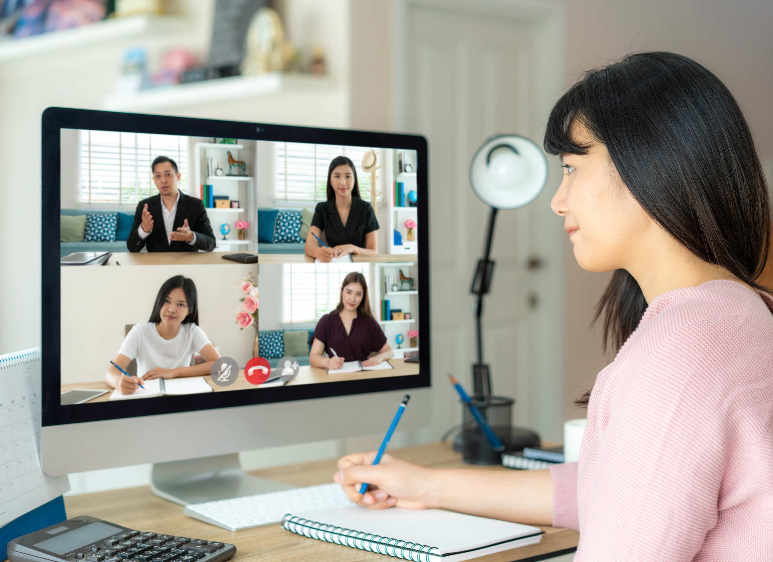 Women taking meeting at home office space